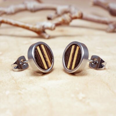 Small post earrings made with dark wenge wood and light sycamore stripes