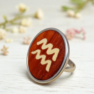 Wooden Aquarius ring with zodiac symbol inlaid in natural wood
